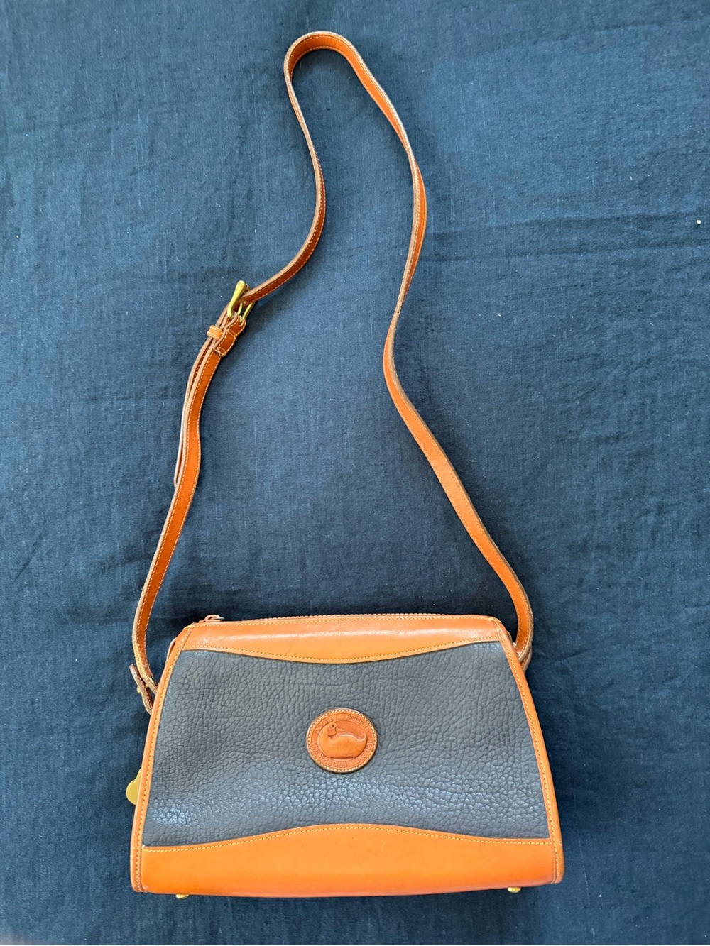 Dooney & Bourke Navy and Tan Pebbled Leather Crossbody